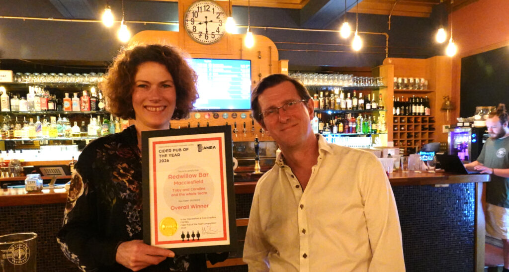 Caroline & Toby Mckenzie of RedWillow with the certificate.
